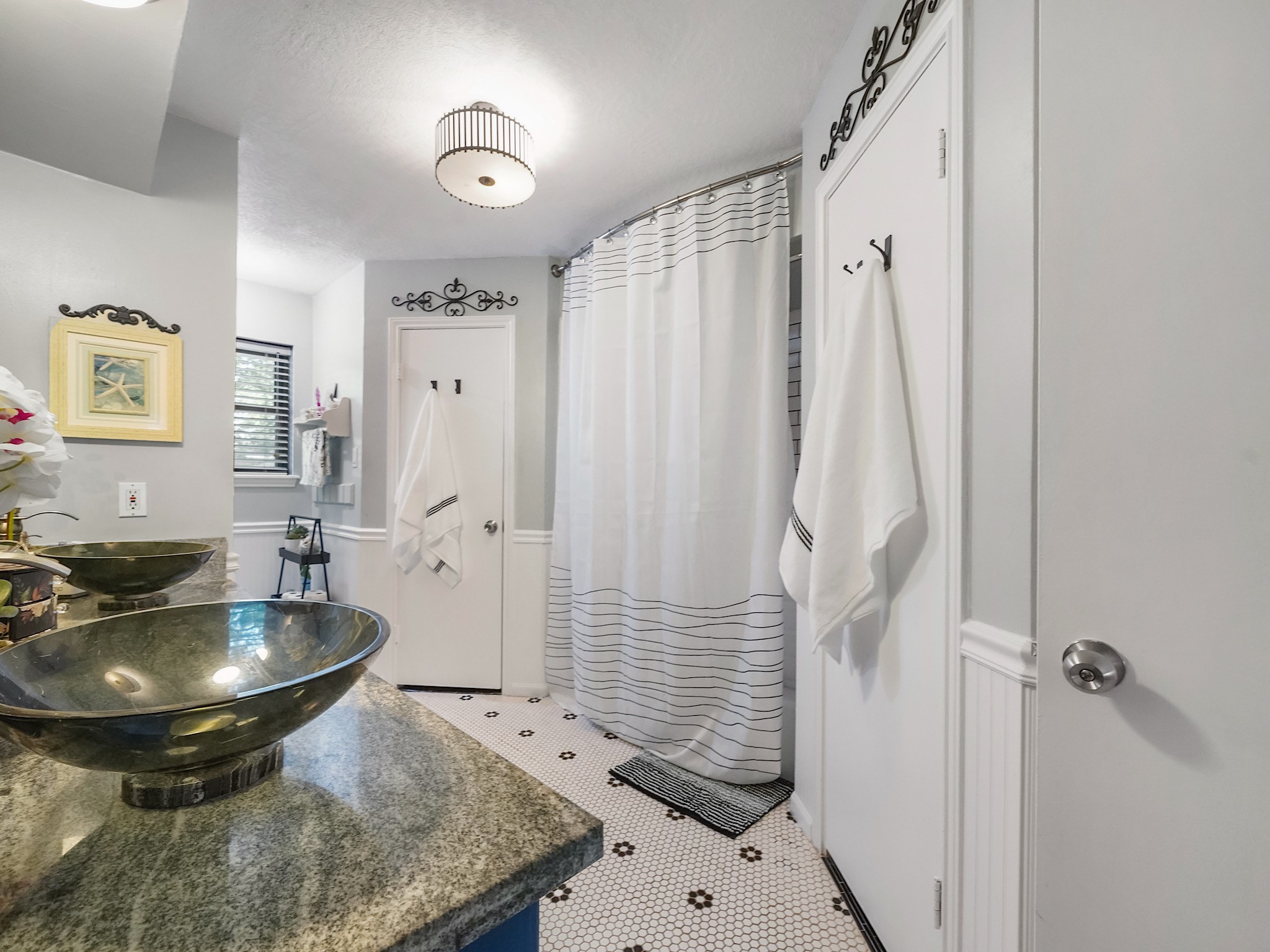 14014 Locke Lane Houston, TX 77077 - Photo 22 of 35 a bathroom with a sink and mirror