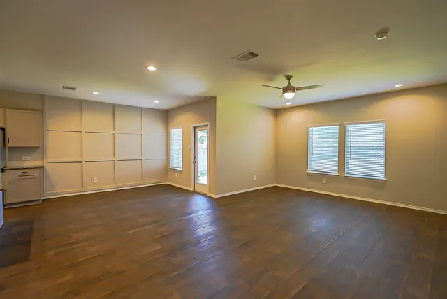 a view of an empty room with a window