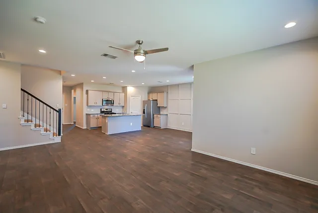 a view of a kitchen with a sink and a window