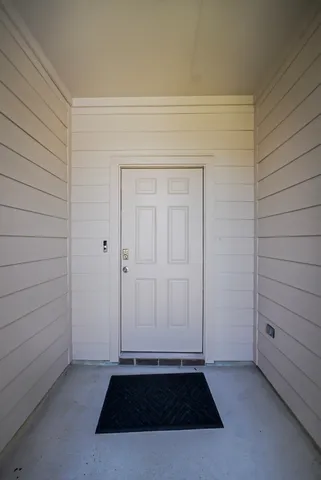an empty room with a bench