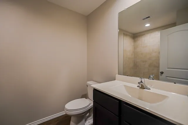 a bathroom with a sink and a toilet
