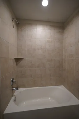 a bathroom with a bathtub