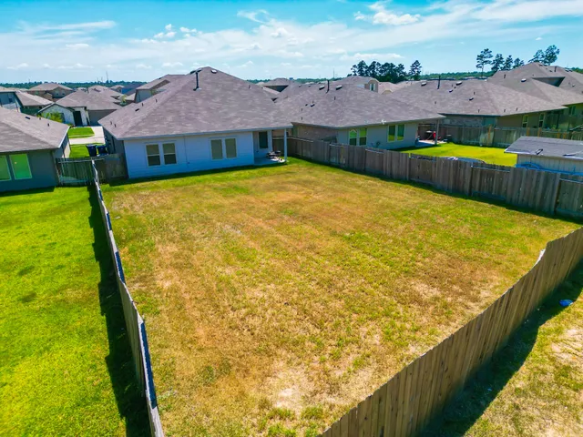 a view of an chairs and table in the patio