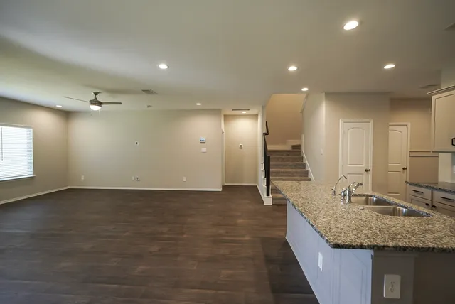 a bathroom with a sink and a large mirror