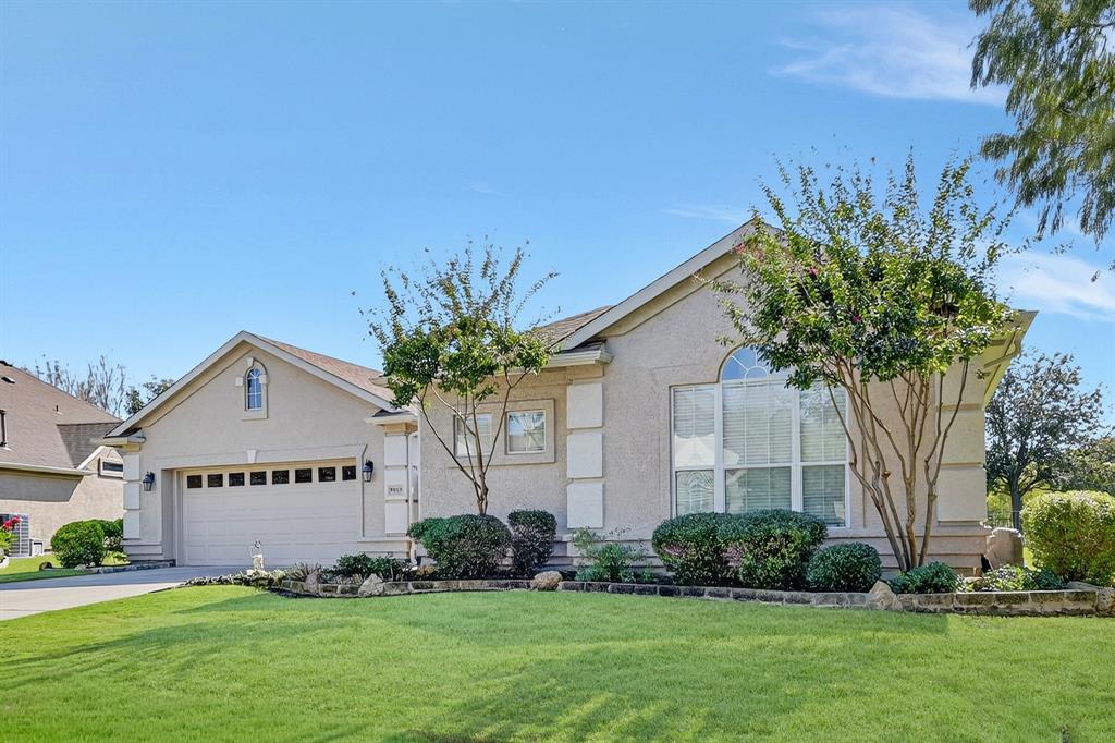9813 Callaway Court Denton, TX 76207 - Photo 2 of 39 a white house with a big yard and potted plants in front of door