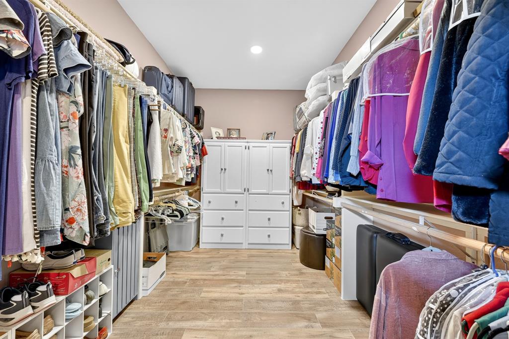 9813 Callaway Court Denton, TX 76207 - Photo 29 of 39 a view of walk in closet with clothes