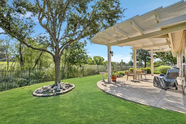 a view of a table and chairs in the garden