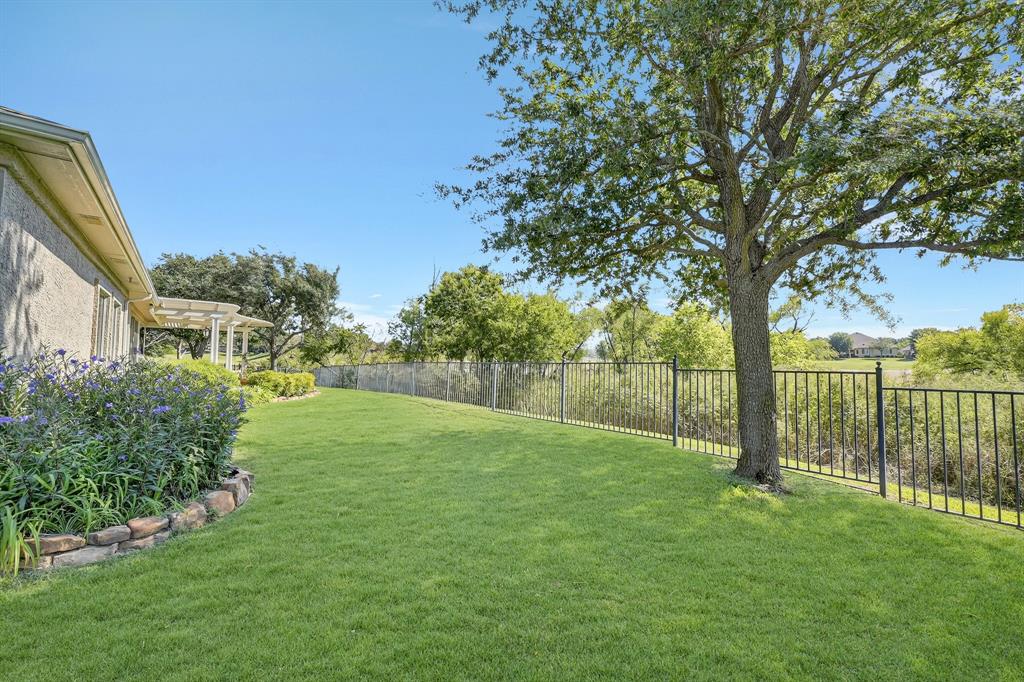 9813 Callaway Court Denton, TX 76207 - Photo 38 of 39 a view of a yard with a tree
