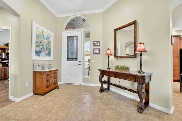 a living room with furniture and a dresser