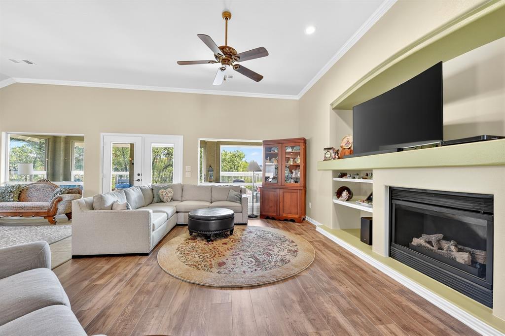 9813 Callaway Court Denton, TX 76207 - Photo 6 of 39 a living room with furniture and a fireplace