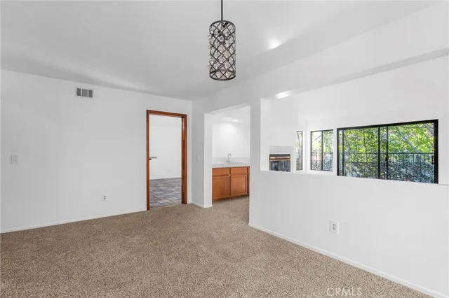 a view of a room with a large window