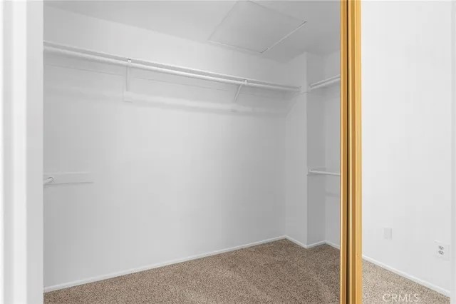 a spacious bathroom with a bathtub sink and mirror