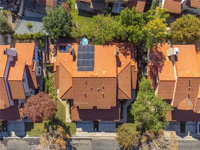 a aerial view of a house with a yard