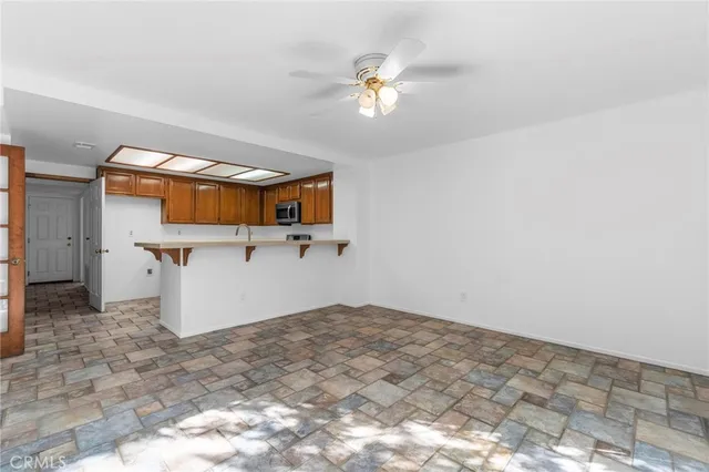 a view of a livingroom with furniture and a fireplace