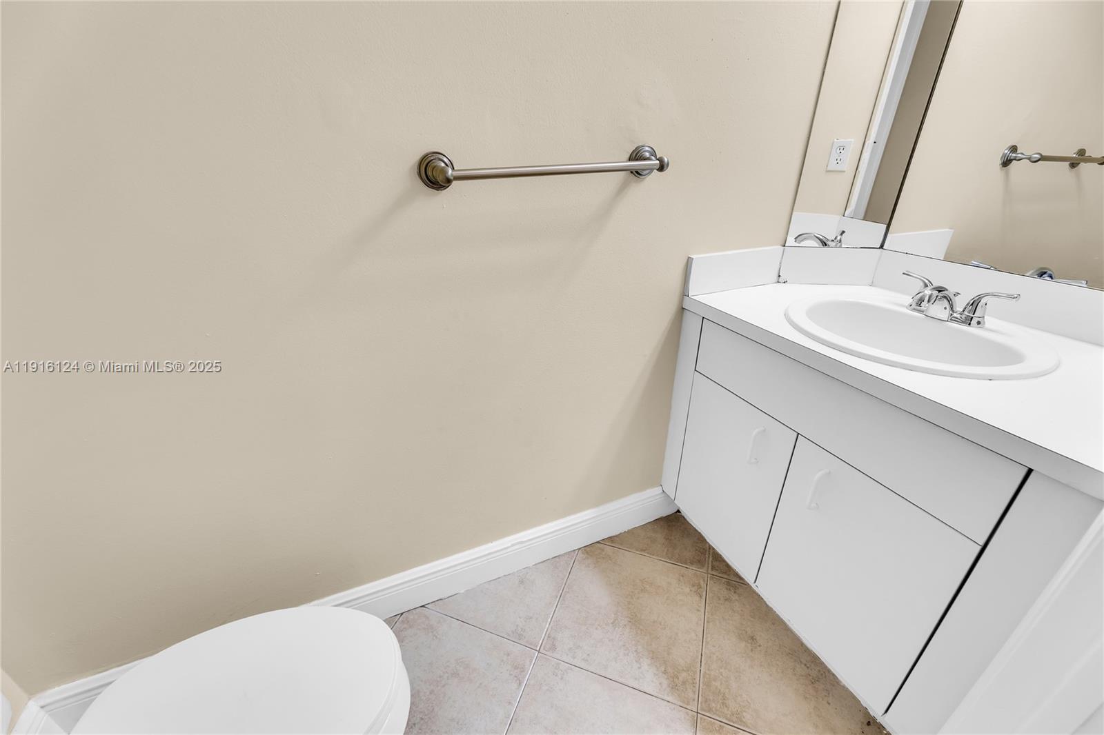304 Southwest 120th Avenue, Unit 304 Pembroke Pines, FL 33025 - Photo 11 of 46 a bathroom with a sink and a vanity