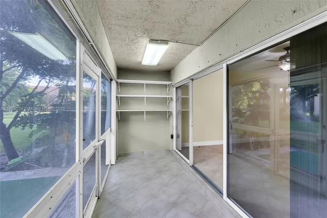 a view of a house with backyard and porch