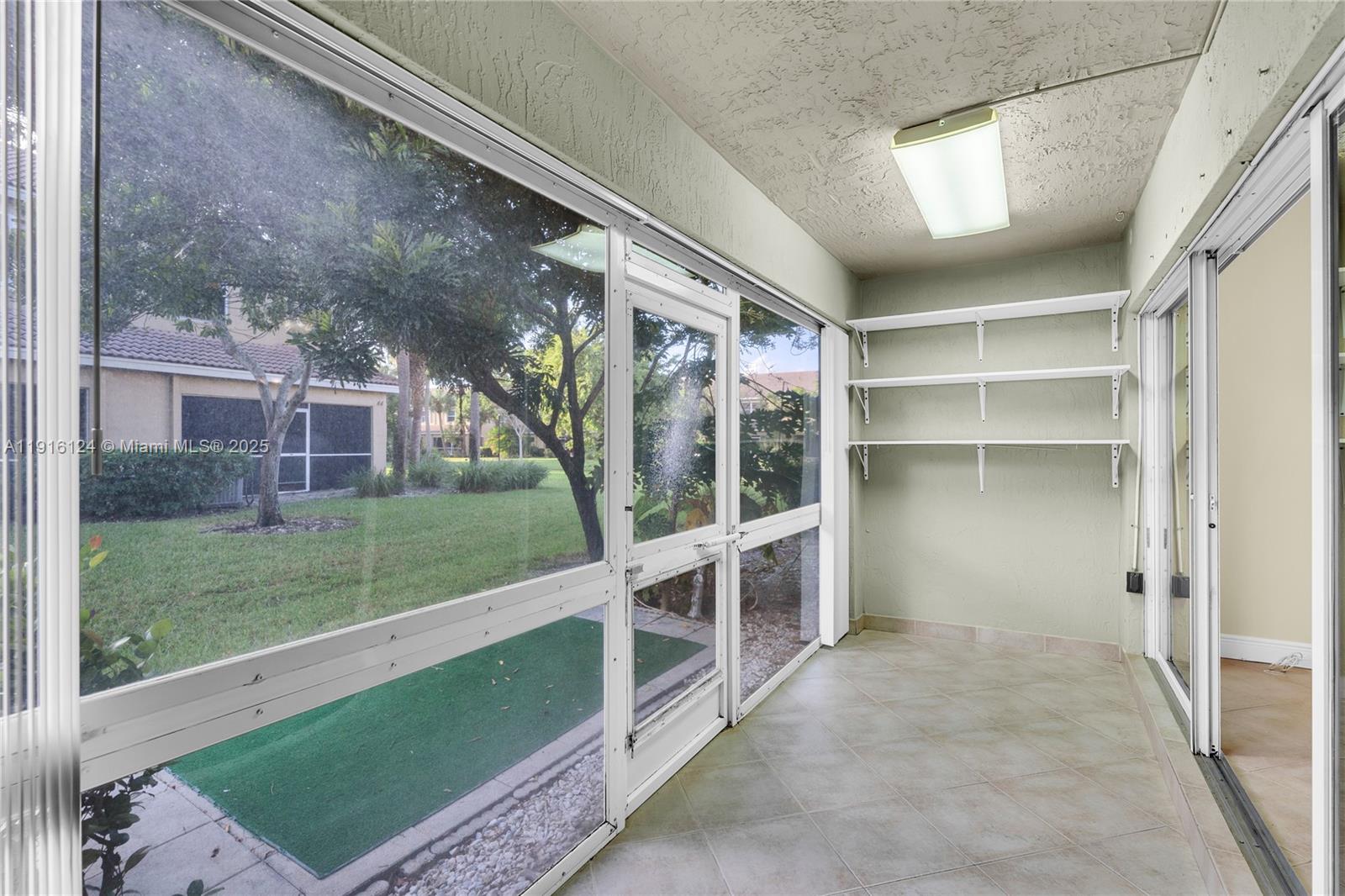 304 Southwest 120th Avenue, Unit 304 Pembroke Pines, FL 33025 - Photo 19 of 46 a view of building with yard