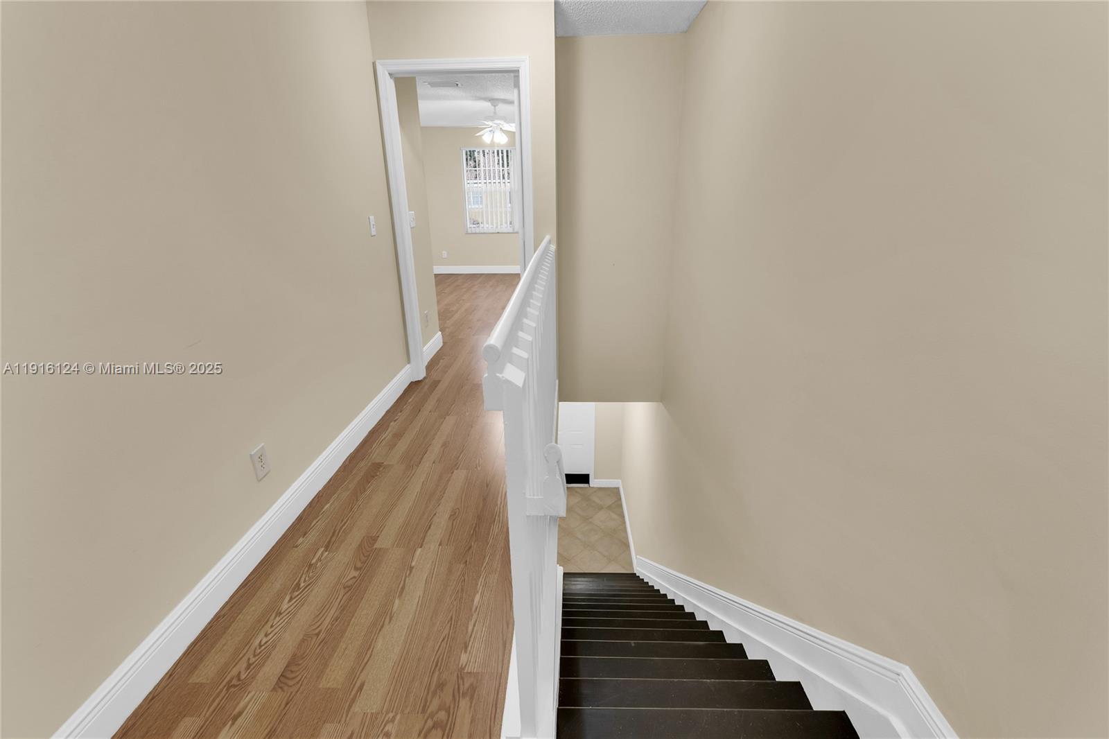 304 Southwest 120th Avenue, Unit 304 Pembroke Pines, FL 33025 - Photo 35 of 46 a view of a hallway with wooden floor and entryway