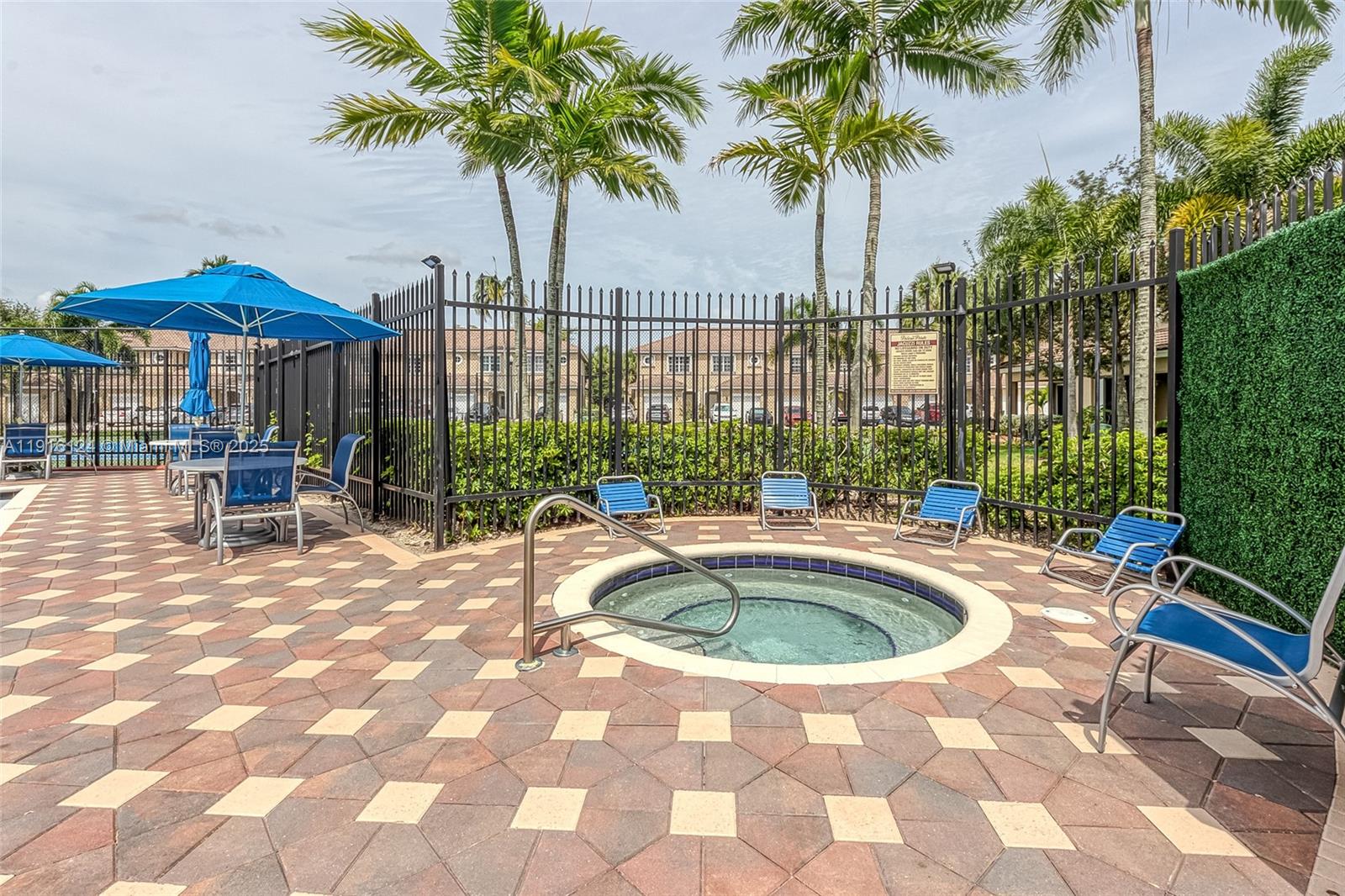 304 Southwest 120th Avenue, Unit 304 Pembroke Pines, FL 33025 - Photo 39 of 46 a view of swimming pool with outdoor seating and plants