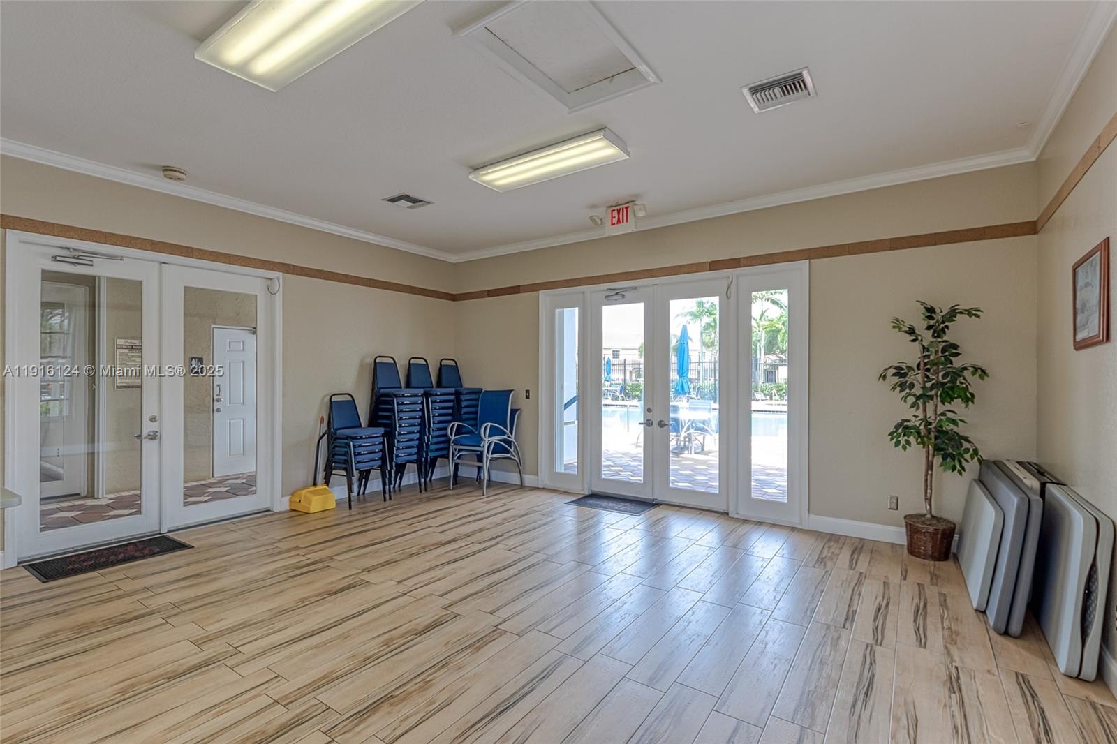 304 Southwest 120th Avenue, Unit 304 Pembroke Pines, FL 33025 - Photo 43 of 46 a living room with furniture and a wooden floor