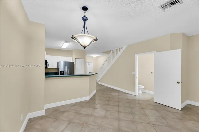 a view of a kitchen with a sink and dishwasher