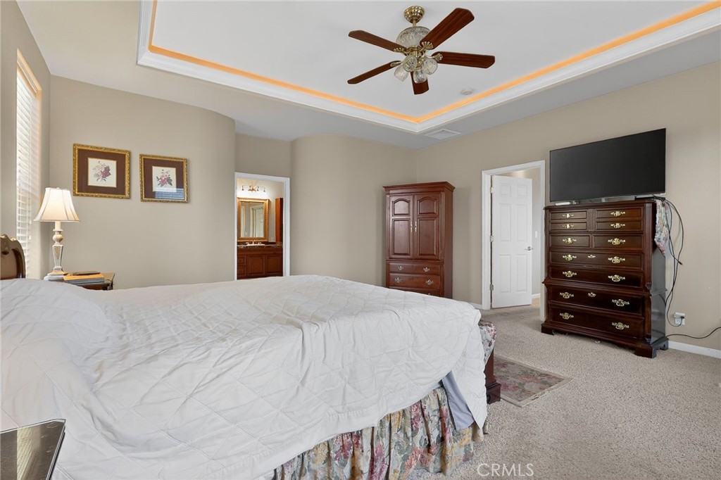 19370 Park Ridge Drive Hidden Valley Lake, CA 95467 - Photo 17 of 61 a bedroom with a bed and a chandelier