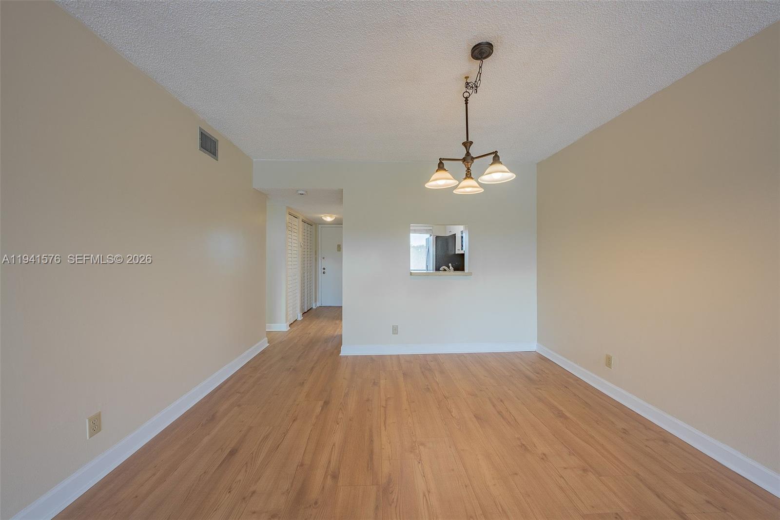 3581 Inverrary Drive, Unit 308 Lauderhill, FL 33319 - Photo 24 of 43 a view of a room with wooden floor and ceiling fan