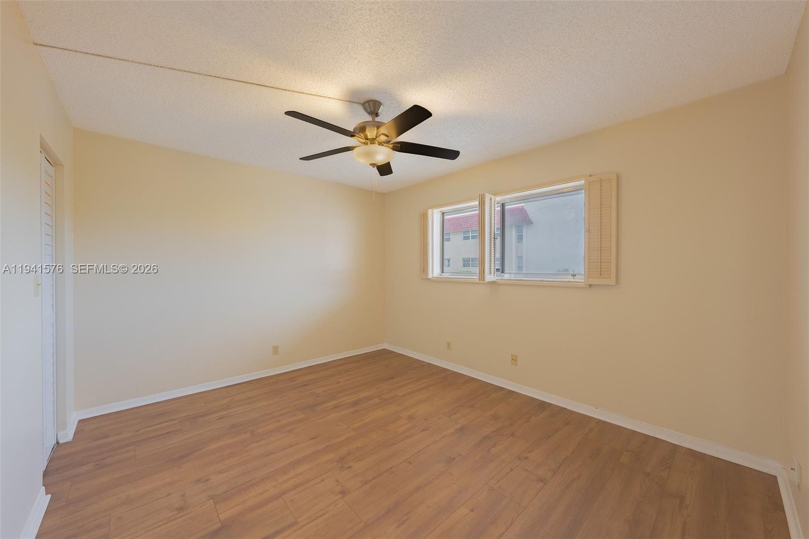 3581 Inverrary Drive, Unit 308 Lauderhill, FL 33319 - Photo 30 of 43 a view of a big room with wooden floor and a ceiling fan