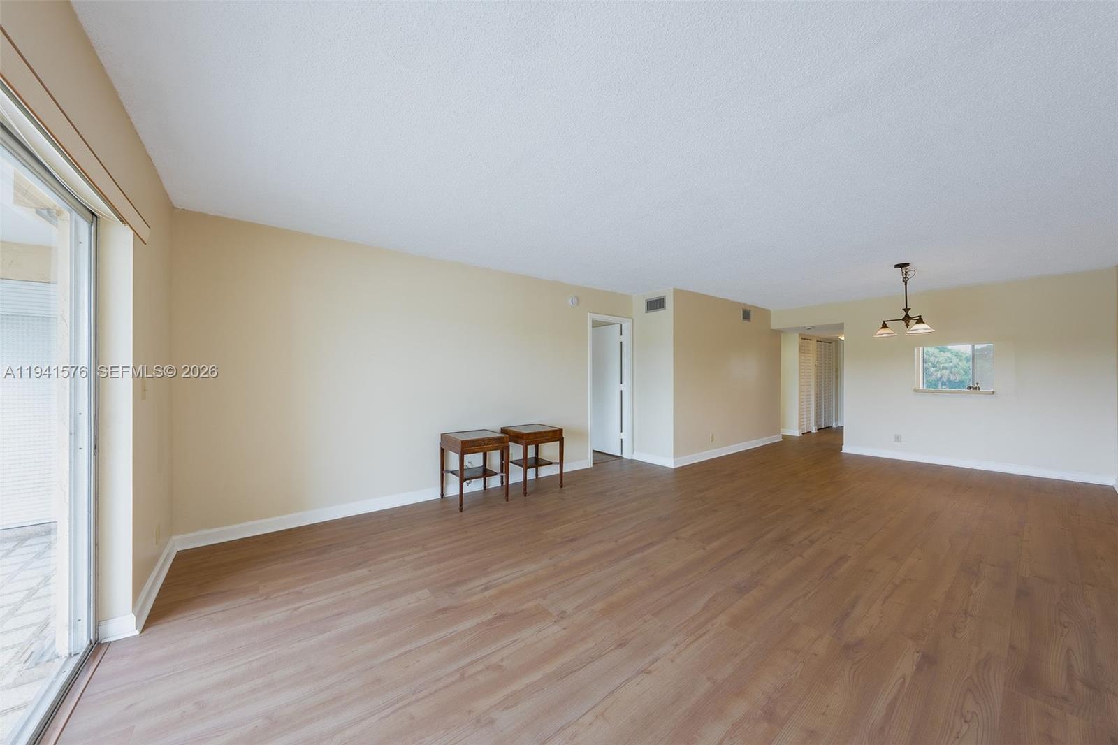 3581 Inverrary Drive, Unit 308 Lauderhill, FL 33319 - Photo 35 of 43 a view of empty room with wooden floor