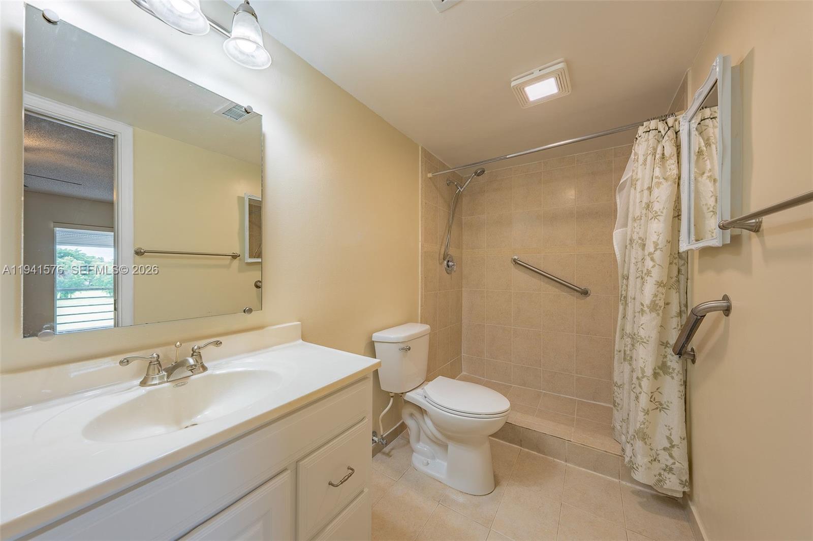 3581 Inverrary Drive, Unit 308 Lauderhill, FL 33319 - Photo 40 of 43 a bathroom with a sink toilet and shower