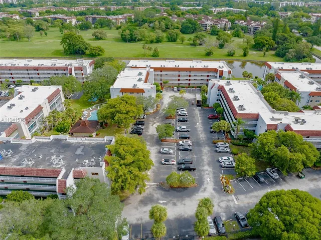 an aerial view of a house with a swimming pool yard and outdoor seating