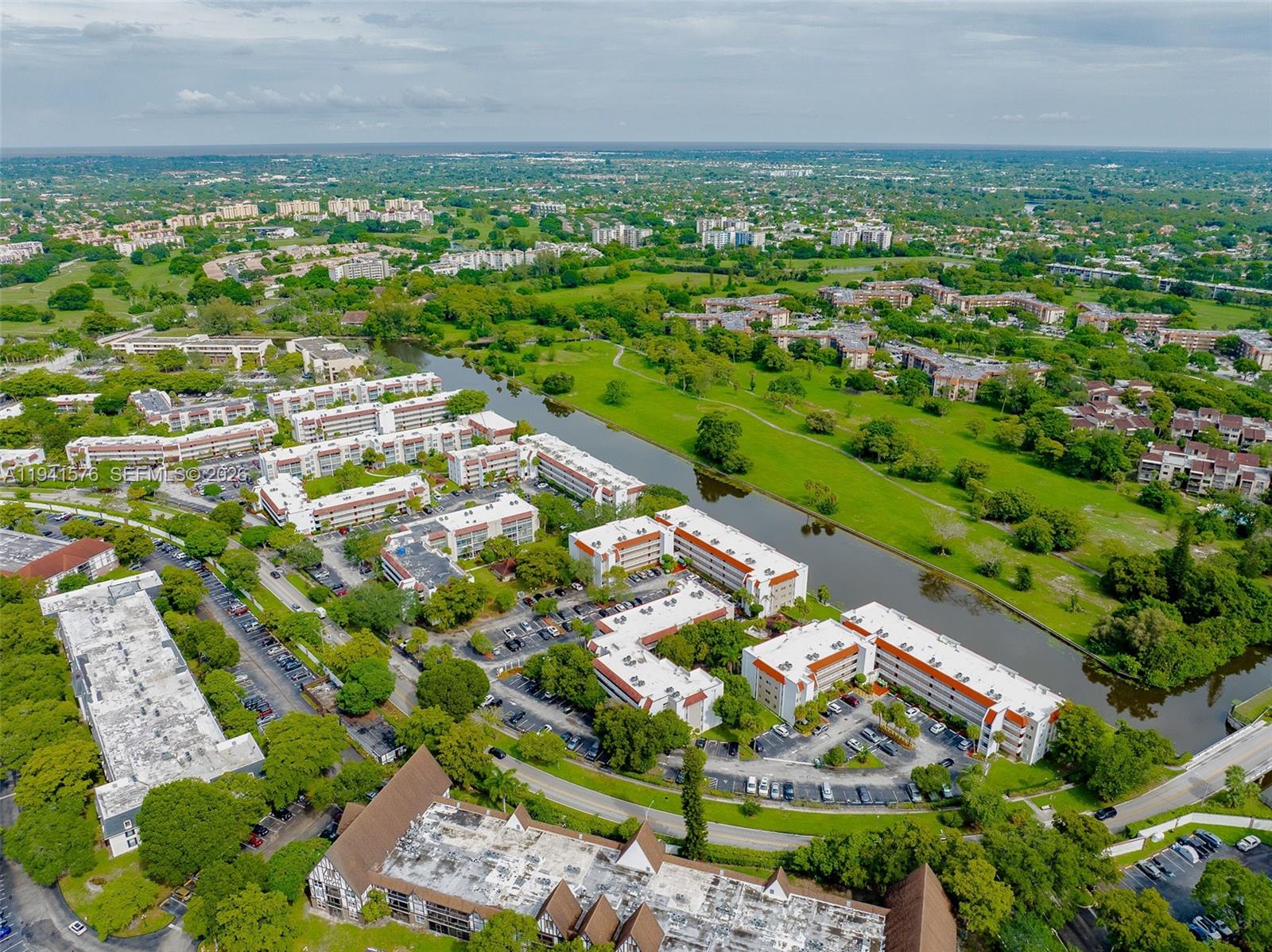 3581 Inverrary Drive, Unit 308 Lauderhill, FL 33319 - Photo 8 of 43 an aerial view of residential houses with outdoor space and trees all around