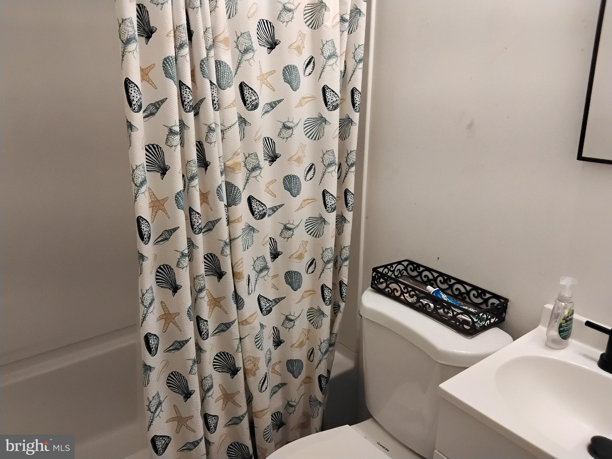 11422 Brandywine Road Clinton, MD 20735 - Photo 14 of 18 a bathroom with a toilet and a sink