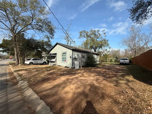 a view of house with snow on the road