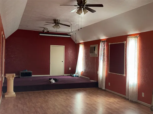 a view of a room with a ceiling fan