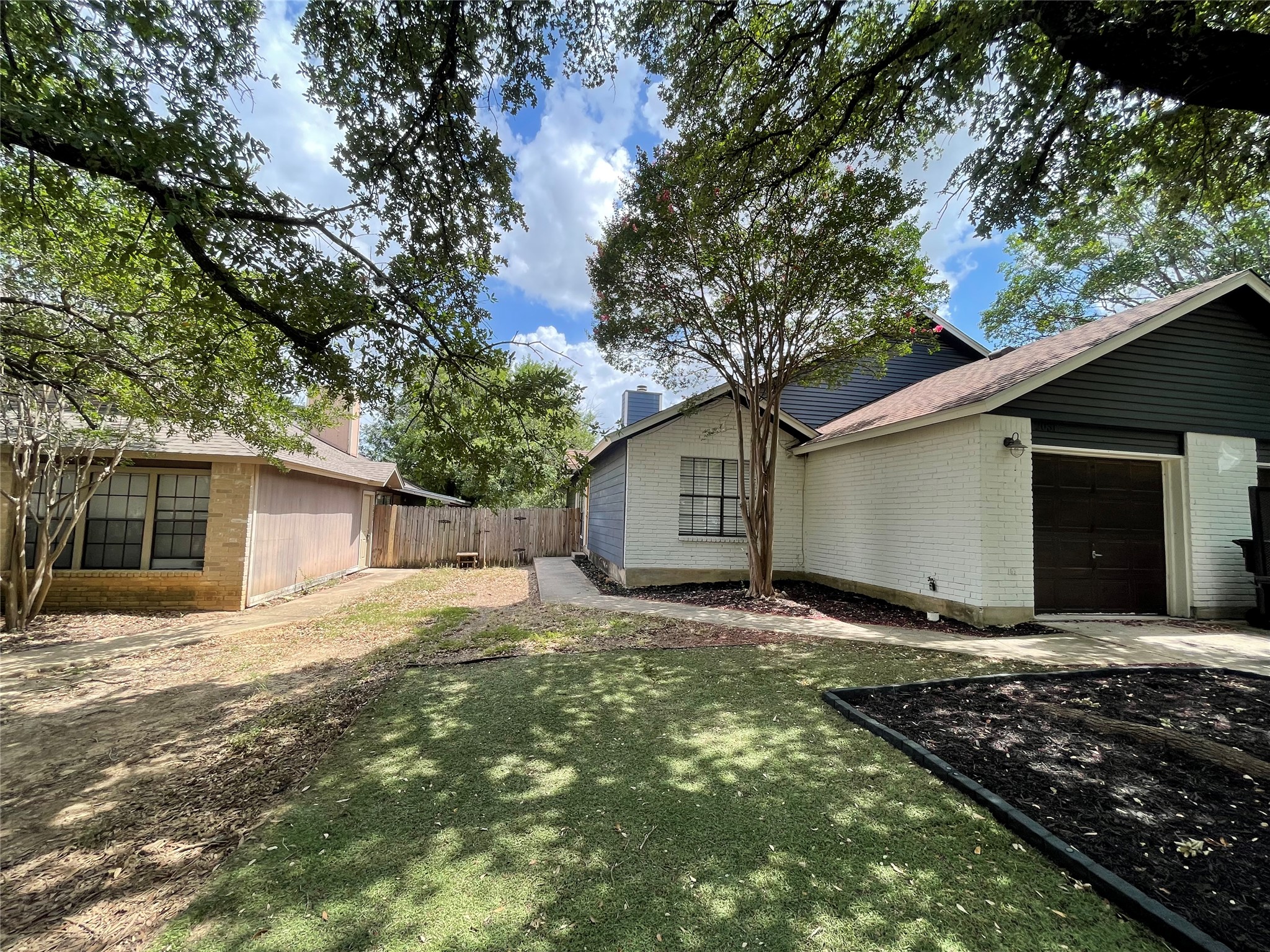 2031 Redwing Way Round Rock, TX 78664 - Photo 2 of 25 A fenced backyard offers a quiet space for relaxation and entertaining.