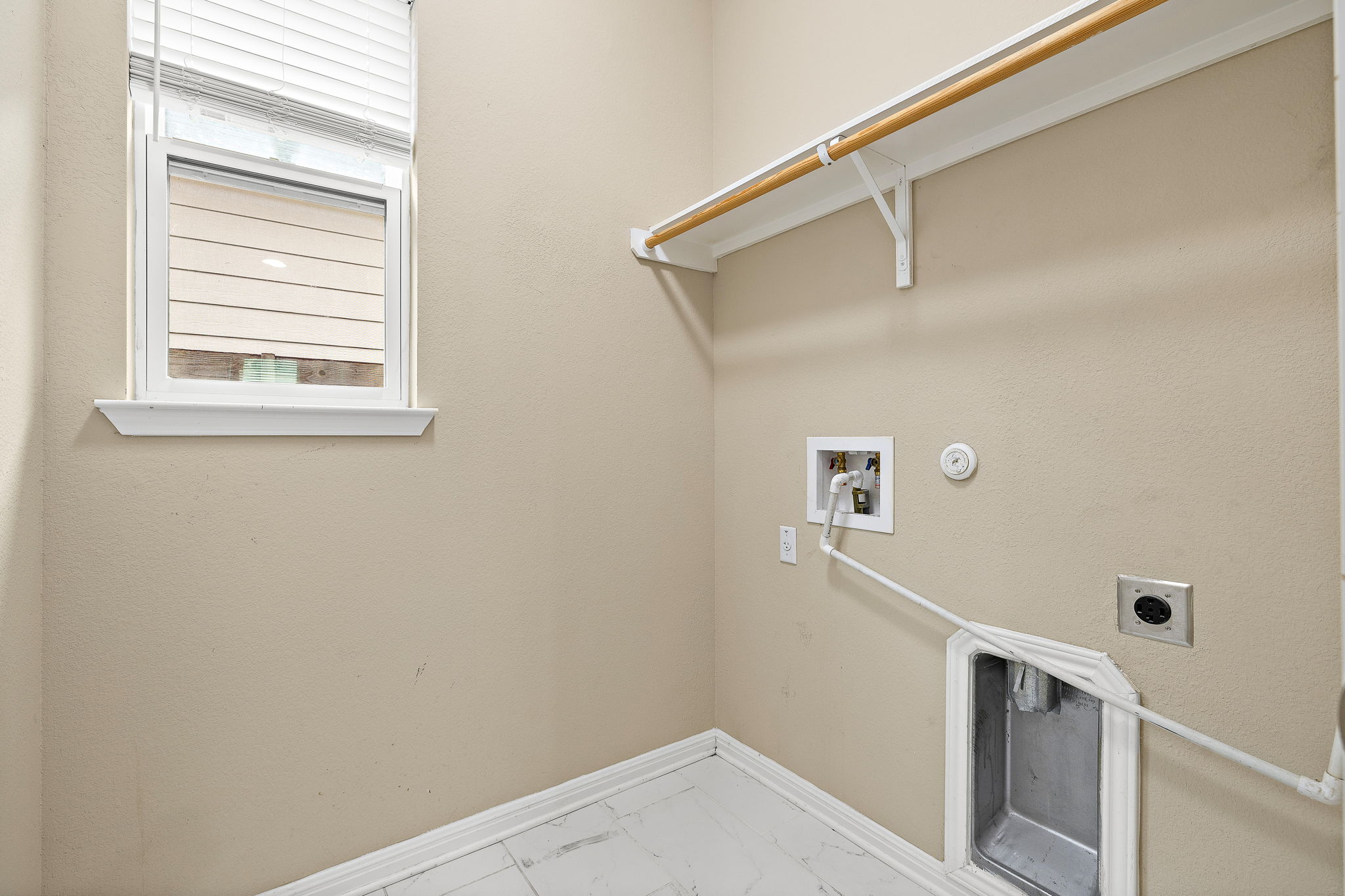 706 Coconut Grove Street Pflugerville, TX 78660 - Photo 22 of 23 Convenient laundry room with washer and dryer connections makes everyday chores simple and efficient.