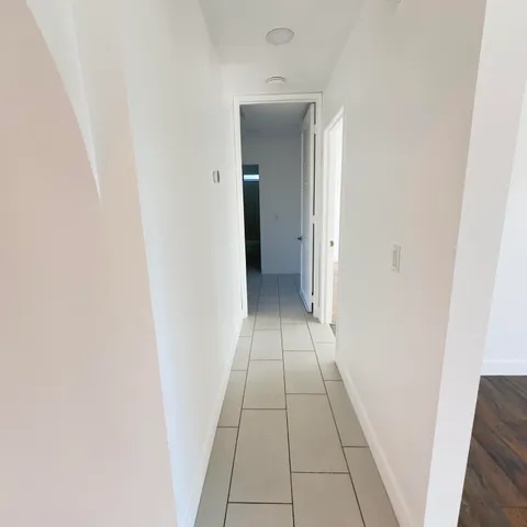 an entryway of a house with windows