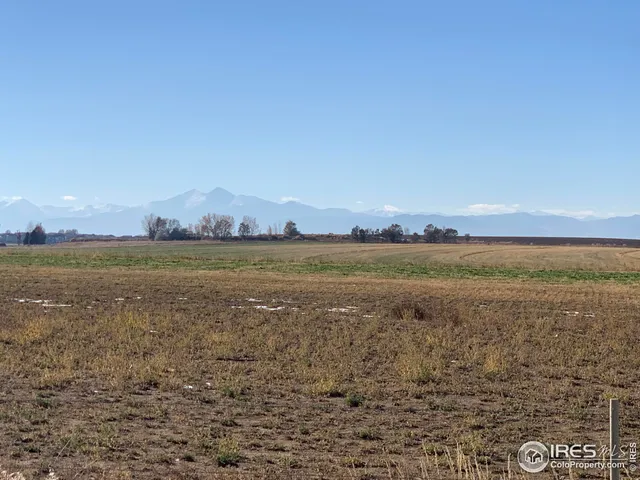 a view of an ocean beach and a mountain