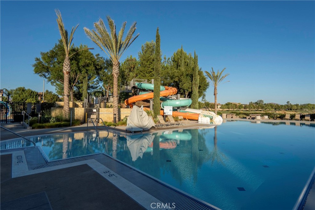 30272 Tattersail Way Menifee, CA 92584 - Photo 33 of 44 a view of swimming pool with outdoor seating and plants