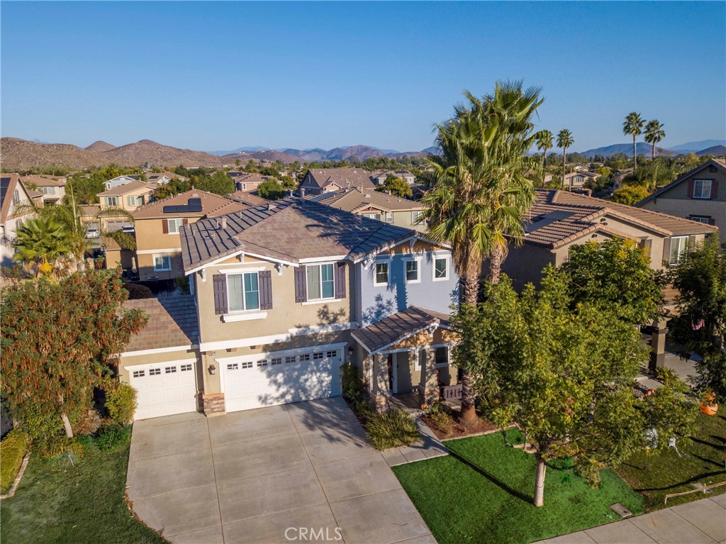 30272 Tattersail Way Menifee, CA 92584 - Photo 4 of 44 an aerial view of a house with a garden