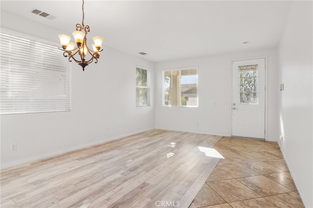 30272 Tattersail Way Menifee, CA 92584 - Photo 9 of 44 a view of a livingroom with a chandelier