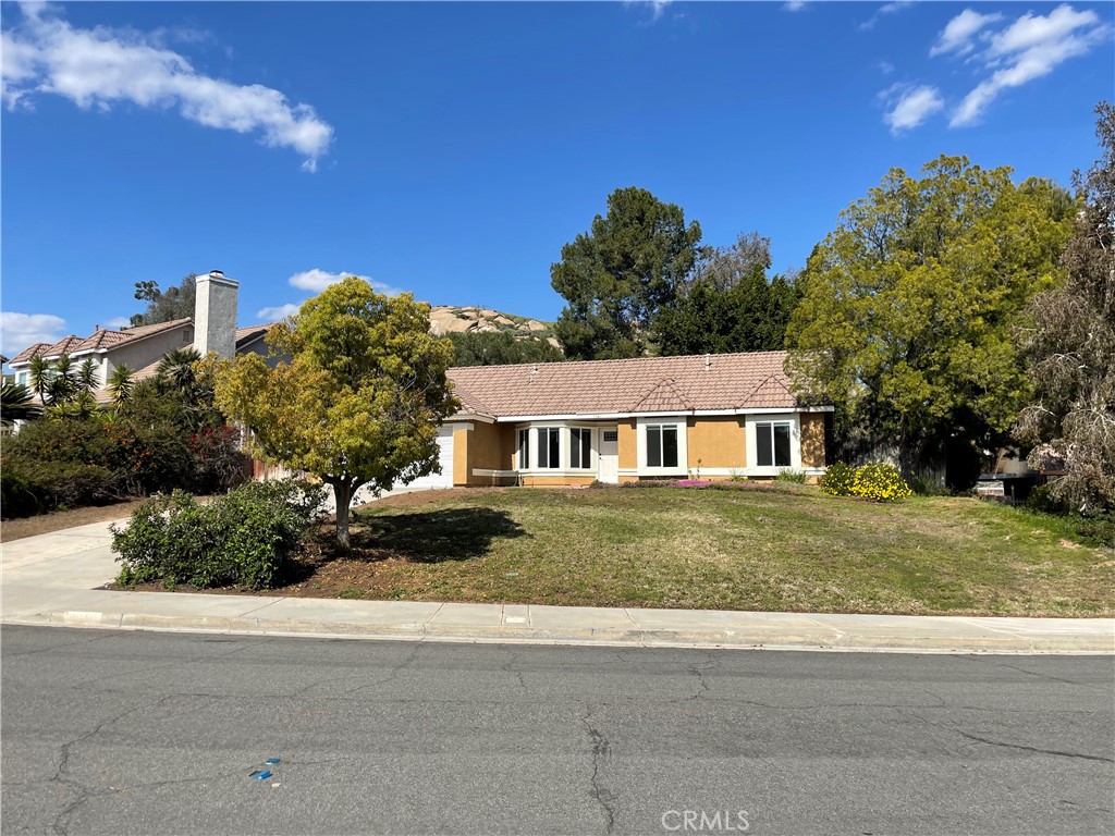 5341 Azul Court Riverside, CA 92505 - Photo 1 of 1 a view of a house next to a yard with big trees