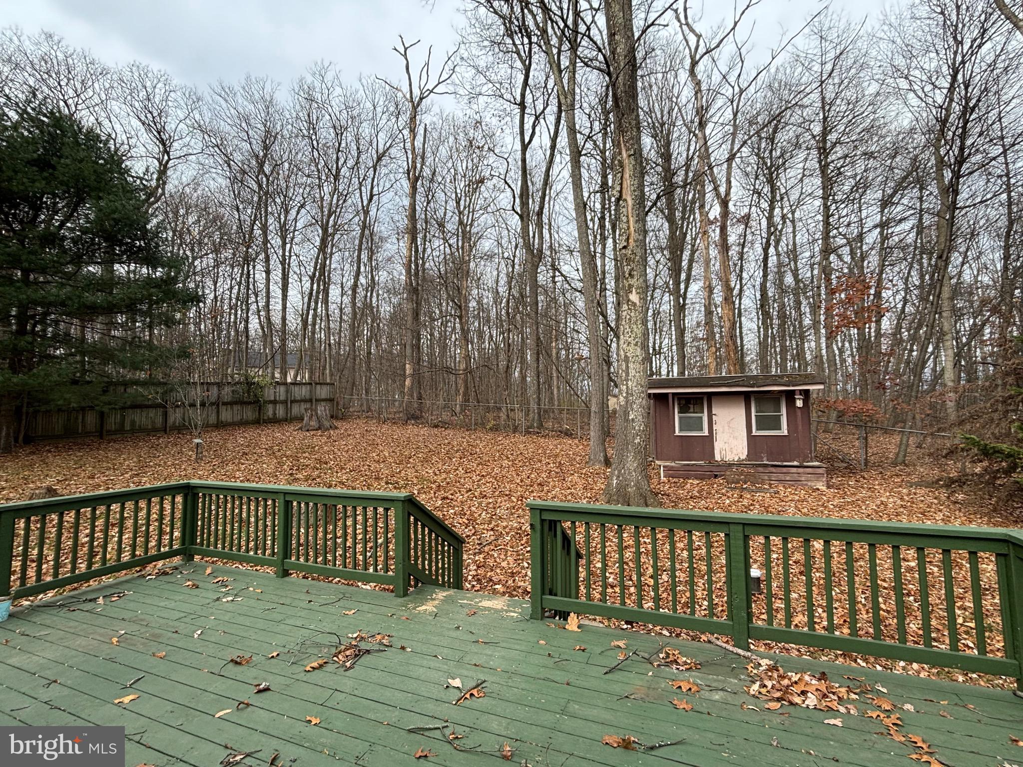 2213 Green Haven Way Hampstead, MD 21074 - Photo 1 of 15 a view of a wooden roof deck