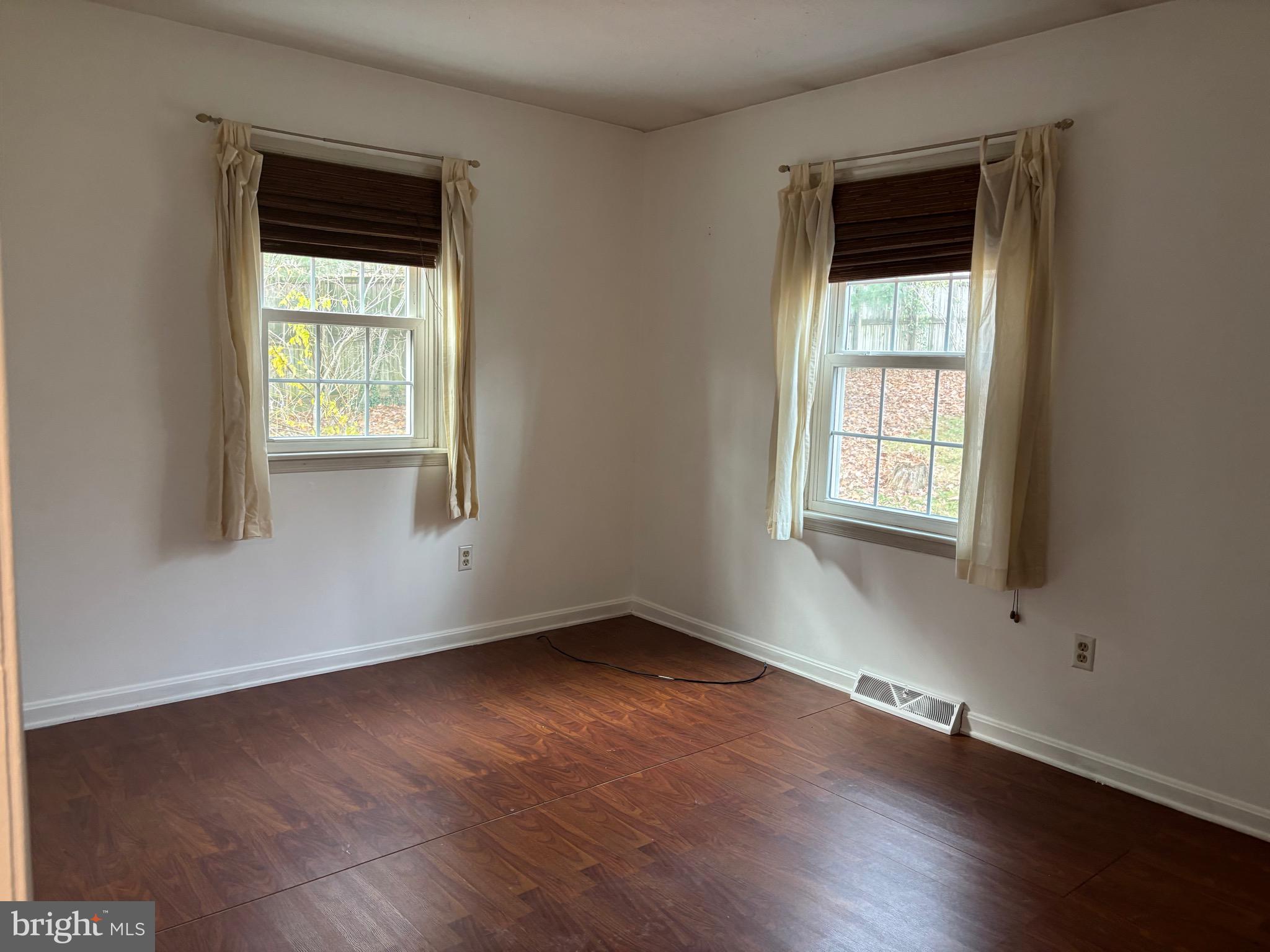 2213 Green Haven Way Hampstead, MD 21074 - Photo 12 of 15 an empty room with wooden floor and windows