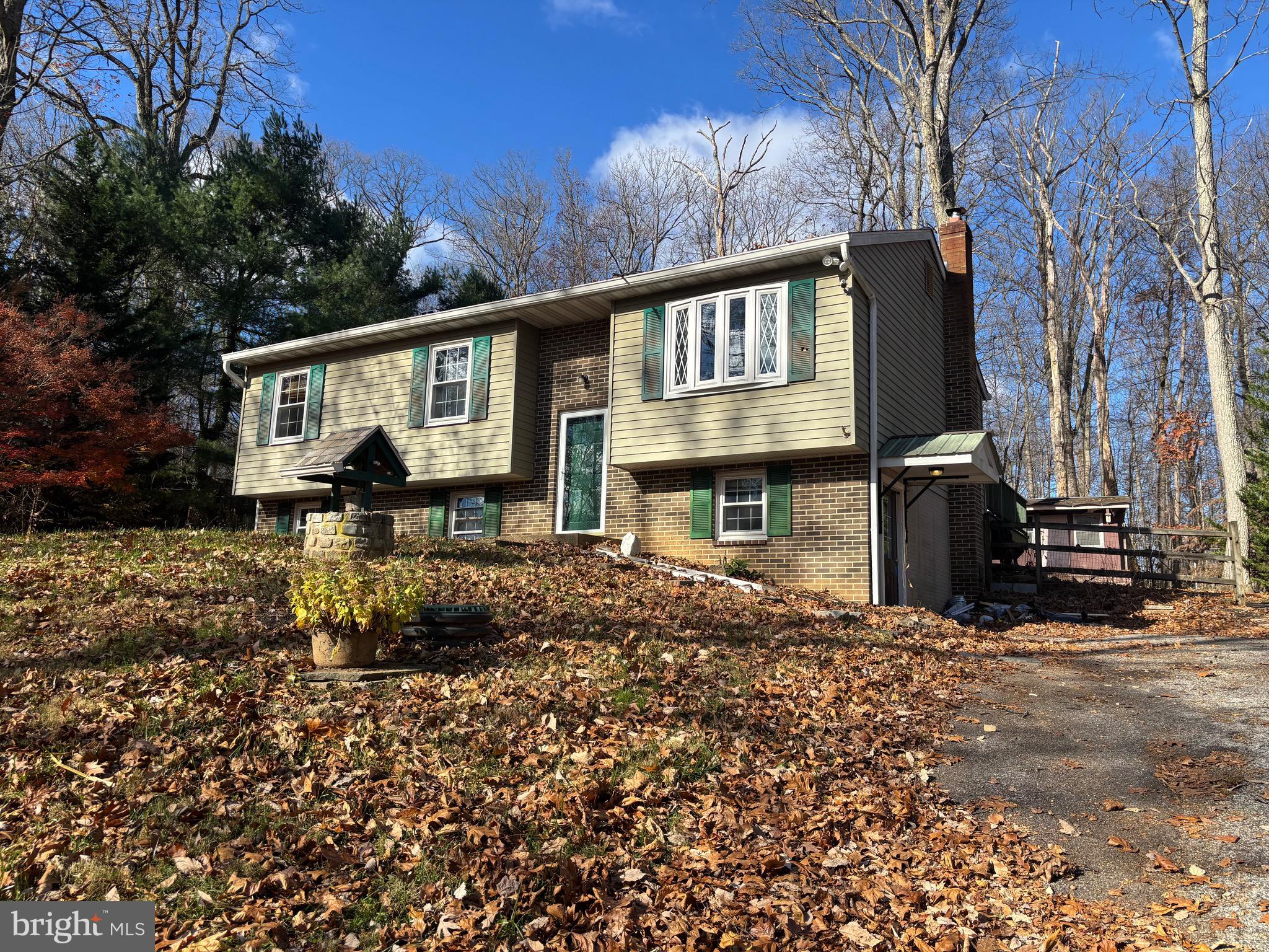 2213 Green Haven Way Hampstead, MD 21074 - Photo 2 of 15 a front view of a house with garden
