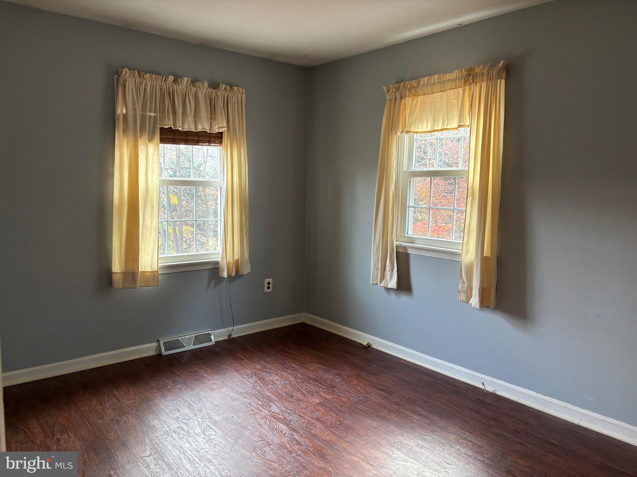 2213 Green Haven Way Hampstead, MD 21074 - Photo 9 of 15 a view of an empty room with wooden floor and a window