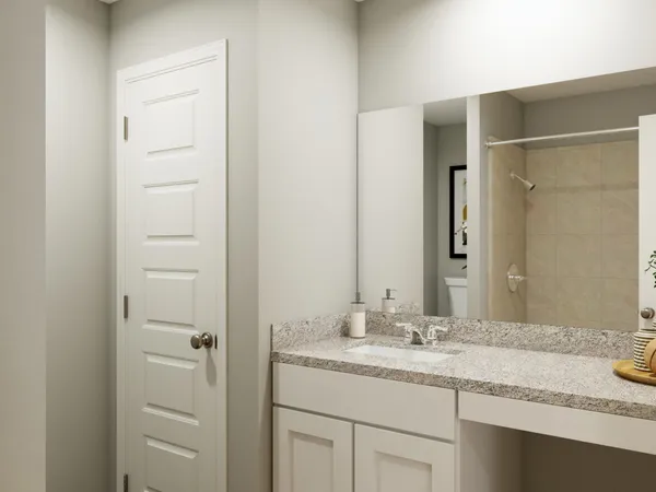 a bedroom with a bed and a desk in it