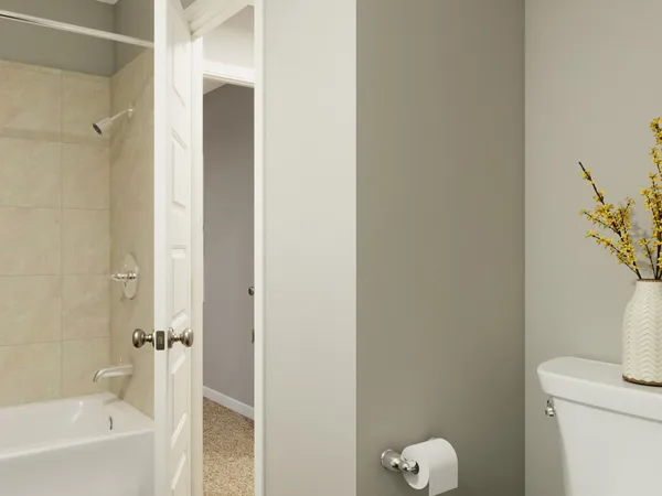 a bedroom with a bed and a mirror