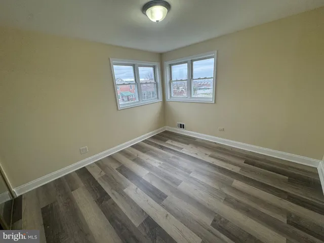 a view of room with window and ceiling fan